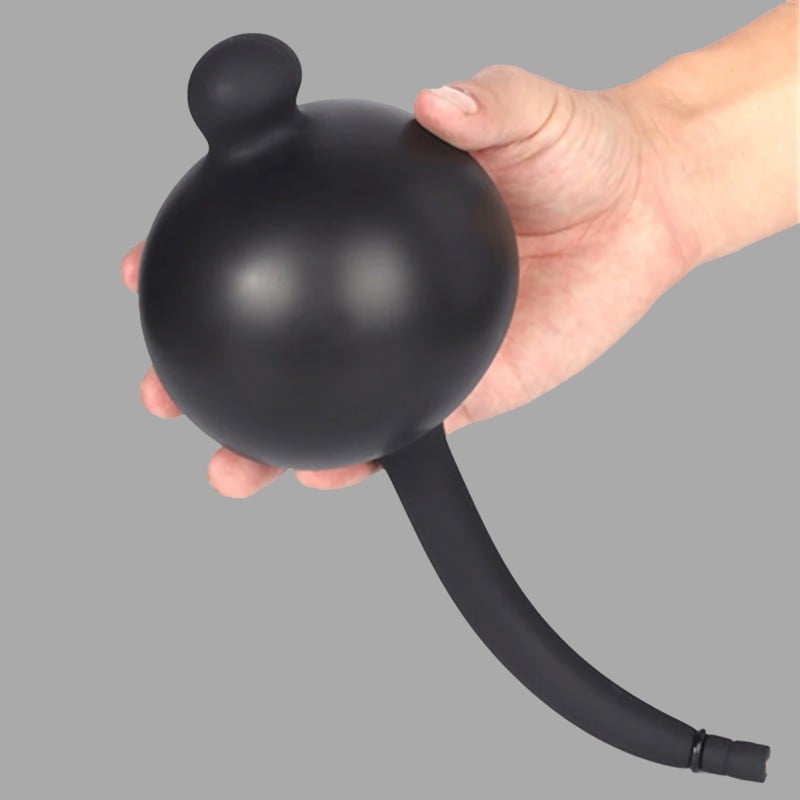 Inflatable butt plug with weight